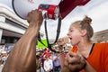 Young woman crying and yelling into megaphone at gun violence pr Royalty Free Stock Photo