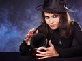 Young woman with crystal ball. Royalty Free Stock Photo
