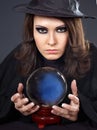 Young woman with crystal ball. Royalty Free Stock Photo