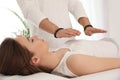 Young woman during crystal healing session in room Royalty Free Stock Photo