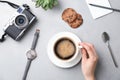 Young woman with cup of delicious hot coffee at table Royalty Free Stock Photo