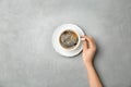 Young woman with cup of delicious hot coffe