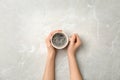 Young woman with cup of delicious hot coffee Royalty Free Stock Photo