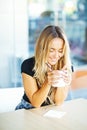 Young woman with cup of tea