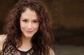 Young woman with curly dark hair