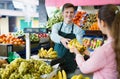 Young woman customer buying yellow bananas Royalty Free Stock Photo