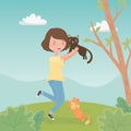 Young woman with cute little cats mascots in the field Royalty Free Stock Photo
