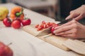 Young woman cutting vegetables Royalty Free Stock Photo