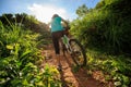 Cyclist carrying mountain bike climbing on summer forest trail Royalty Free Stock Photo