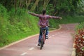 Woman cyclist fun riding bike on forest trail Royalty Free Stock Photo