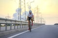 Young Woman Cyclist Riding Road Bike at Sunset. Adventure, Healthy Lifestyle, Sport Royalty Free Stock Photo