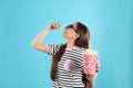 Young woman with 3D glasses eating tasty popcorn Royalty Free Stock Photo