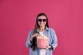 Young woman with 3D glasses and tasty popcorn Royalty Free Stock Photo