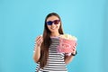 Young woman with 3D glasses and tasty popcorn Royalty Free Stock Photo