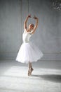 Young woman dances a solo ballet.