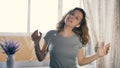 Young woman dancing with a garland in her hair. Slow motion. Winter Holidays Concept Royalty Free Stock Photo