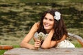 Young woman with dandelions summer outdoor, beautiful bride has