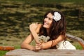 Young woman with dandelions summer outdoor, beautiful bride has Royalty Free Stock Photo