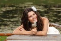 Young woman with dandelions summer outdoor, beautiful bride has