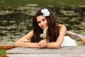 Young woman with dandelions summer outdoor, beautiful bride has