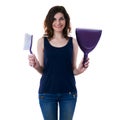 Young woman in dark T-shirt and green rubber gloves over white isolated background Royalty Free Stock Photo