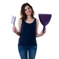 Young woman in dark T-shirt and green rubber gloves over white isolated background Royalty Free Stock Photo