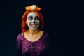 A young woman in day of the dead mask skull face art. Royalty Free Stock Photo