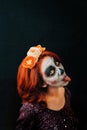 A young woman in day of the dead mask skull face art. Royalty Free Stock Photo