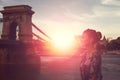 Young woman daydreaming in sunrise at Szechenyi Chain Bridge at Budapest Royalty Free Stock Photo