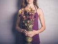 Young woman with dead flowers Royalty Free Stock Photo