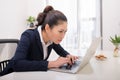 Young woman deep in thought in front of a laptop Royalty Free Stock Photo