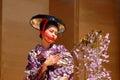 A young woman demonstrates a traditional Japanese dance