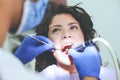 Young woman at dentist . Close up.