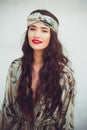 A young woman in the desert in the American Indian style