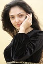 Young woman in desert calling by cellphone closeup