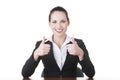 Young woman at the desk gesturing OK Royalty Free Stock Photo