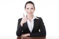 Young woman at the desk gesturing OK Royalty Free Stock Photo