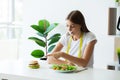 Young woman on a diet, eats only salad and tries to lose weight Royalty Free Stock Photo