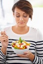 Young woman, diet and salad or healthy food for detox, breakfast and lunch at home. A happy person with green fruits Royalty Free Stock Photo