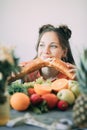 Young woman on a diet succumbed to temptation and passionately bites a white crispy long loaf