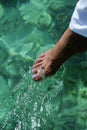 Young woman dipping toes in water