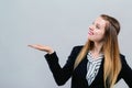 Young woman with displaying hand gesture