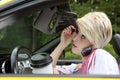 Young woman distracted while driving Royalty Free Stock Photo