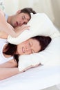 Young woman disturbed by her boyfriend's snores Royalty Free Stock Photo