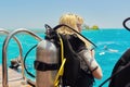 Young woman diver preparing for scuba diving Royalty Free Stock Photo