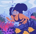 Young woman in diving mask with snorkel swimming and observing coral reef and fishes at sea bottom. Underwater swimmer