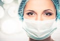 Young woman doctor in cap and face mask Royalty Free Stock Photo