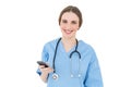 Young woman doctor holding her smartphone Royalty Free Stock Photo