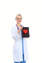 Young woman doctor holding a red heart, isolated on white background. Woman doctor Royalty Free Stock Photo