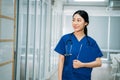 Young woman doctor holding reports in hospital Royalty Free Stock Photo